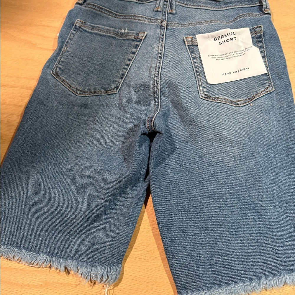 Good American Denim Bermuda Shorts in Medium Blue with Frayed Hem - Picture 5 of 7